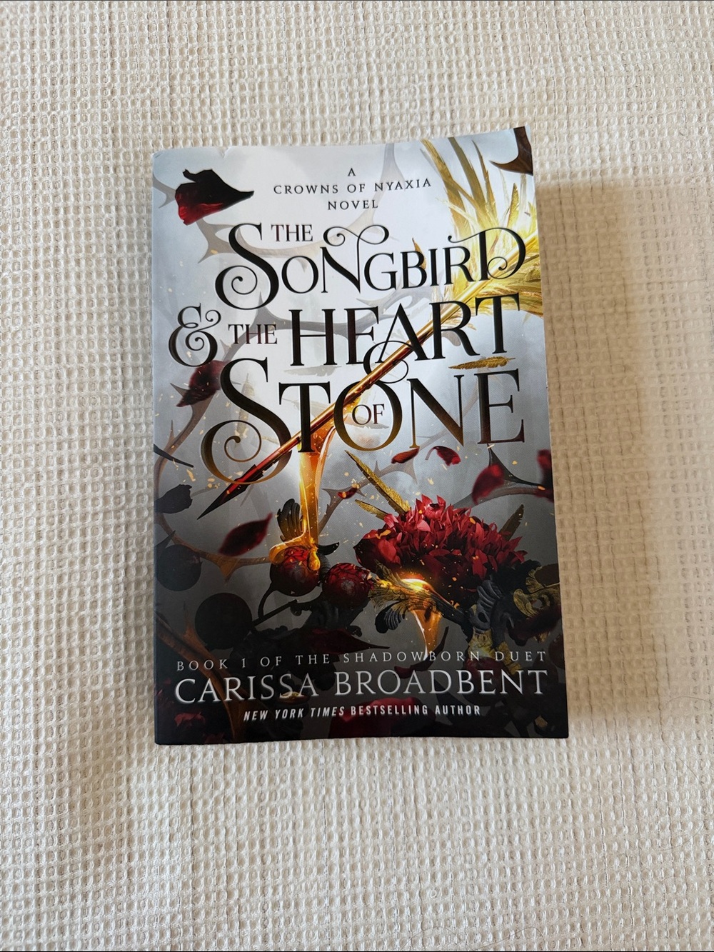 The Songbird & The Heart of Stone (Crowns of Nyaxia Book 3) Carissa Broadbent